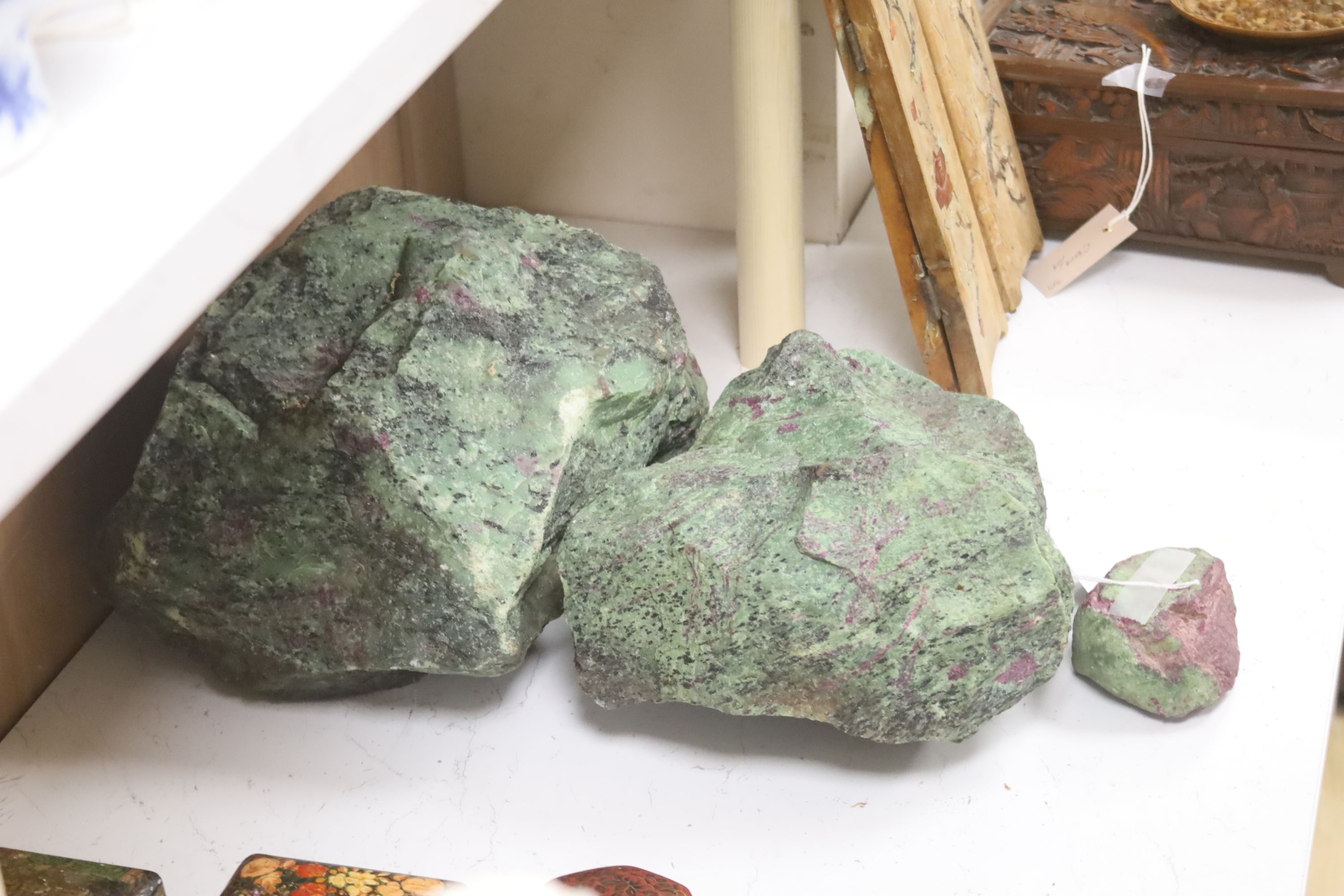 Three fragments of Anyolite (or ruby in zoisite) originating from a ruby mine in Kenya, largest 32 x 22cm